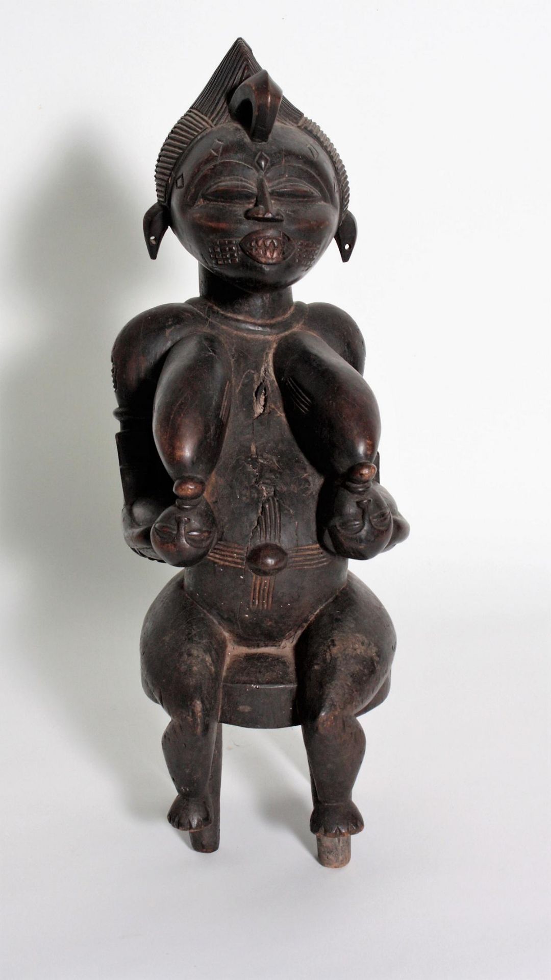 Mutter mit Zwillingen, Senufo, Elfenbeinküste, 1. Hälfte 20. Jh.Schweres Holz, geschnitzt, dunkler