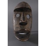 Antike Maske der Dan-Kran, Elfenbeinküste 1. Hälfte 20. Jh.Holz geschnitzt, dunkle Patina , nach
