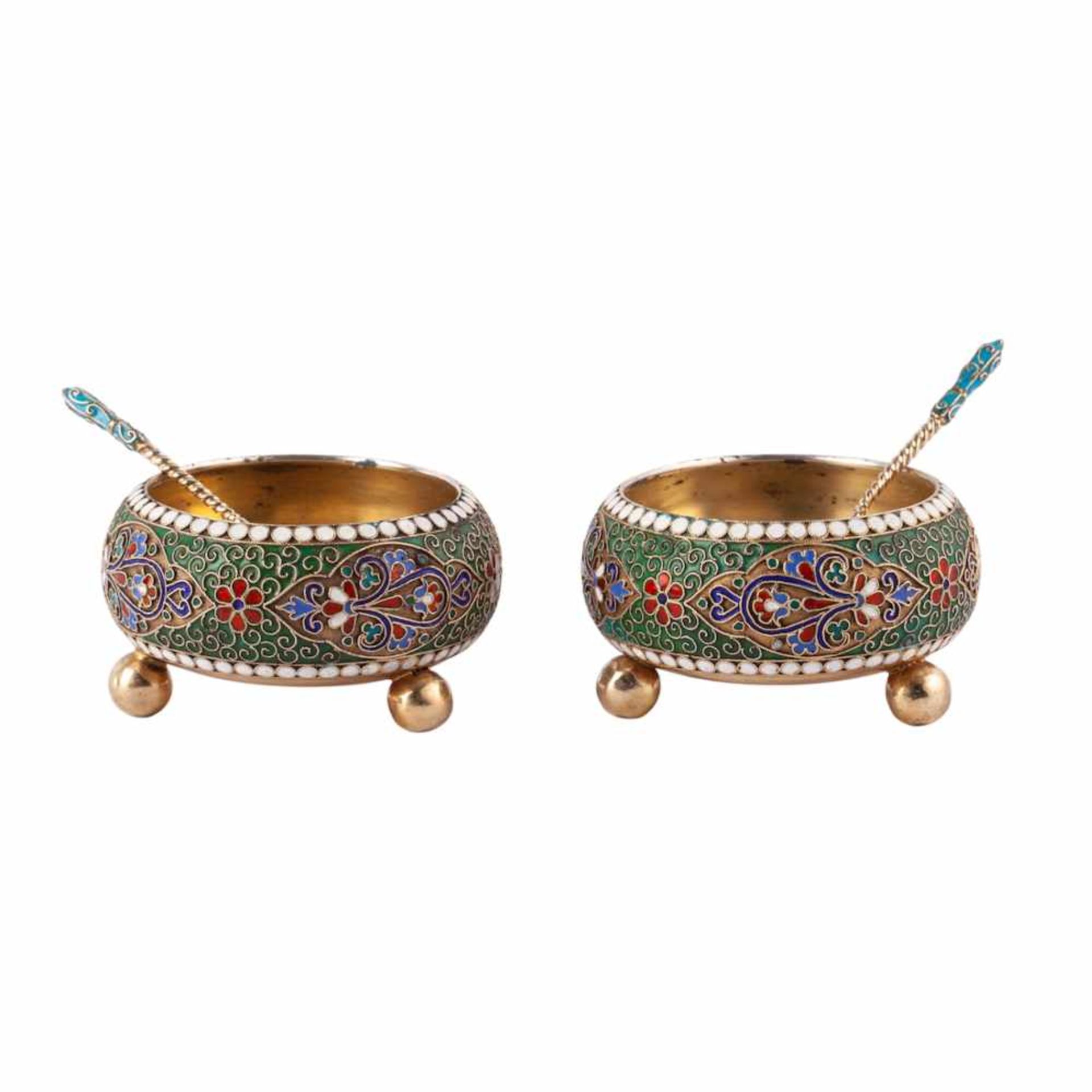 A pair of massive silver and enamel salt cellars