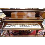 An early 20th century Schubert baby grand boudoir piano retailed by Harrods