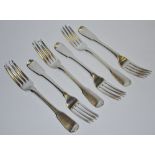 A set of six George III forks by William Ellerby dated 1807 with stag's head erased monogram to