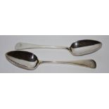 A pair of Scottish George III serving spoons dated 1812 by Robert Gray & Son monogrammed GW to