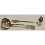A William IV silver ladle dated 1833;