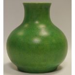 A Pilkington Royal Lancastrian squat baluster shaped vase, green mottled glaze,