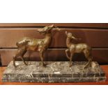 An Art Deco French bronzed sculptural group, Doe and Fawn, naturalistically modelled,