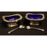 A pair of silver open salts and spoons, Birmingham 1931, Barker Bros,