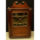 A George III mahogany wall hanging corner display cabinet,