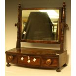 A 19th century mahogany dressing mirror, adjustable plate above three small drawers, bun feet,
