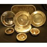 Silver plate - a set of eleven silver plated plates, beaded rims, trio of wine bottle stands,