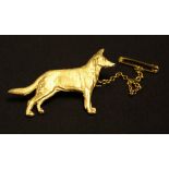 A 9ct gold Alsatian dog brooch by Kenart, safety chain, approx 6.