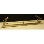 An early 20th century brass fire curb/fender,