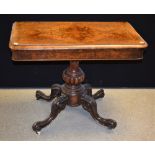 A Victorian walnut card table, folding top enclosing a baize lined playing surface,