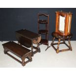 A 17th century style Priory oak occasional table; another similar; a three-tier folding cake stand;