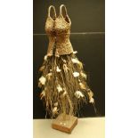 An unusual naturalistic woven and twig torso figure of a lady, trunk column, rectangular base,