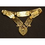 A 9ct gold bracelet with fret cut Greek Key decoration,