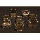 A collection of silver napkin rings,