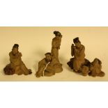 A set of three stoneware Chinese figure groups,