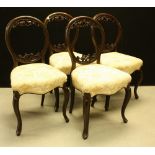 A set of four Victorian cartouche back dining chairs, c.