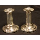 A pair of Victorian silver Doric column candlesticks, cannon barrel pillars, circular bases,