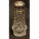 A silver topped glass sugar caster,