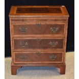 A George III design mahogany bachelor's chest, crossbanded top above a slide,