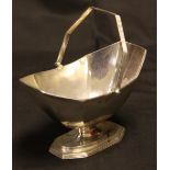 A George III style silver sugar basket, reeded handle, Thomas Bradbury, London 189,