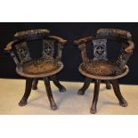 A pair of late 19th/early 20th century oak swivel chairs,