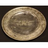 A Middle Eastern white metal circular tray