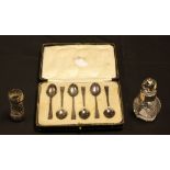 A set of six silver teaspoons, Sheffield hallmark; an Edwardian silver mounted scent bottle,