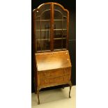 An early 20th century walnut and mahogany bureau bookcase,