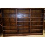 A large early 20th century oak three section estate office or library bookcase