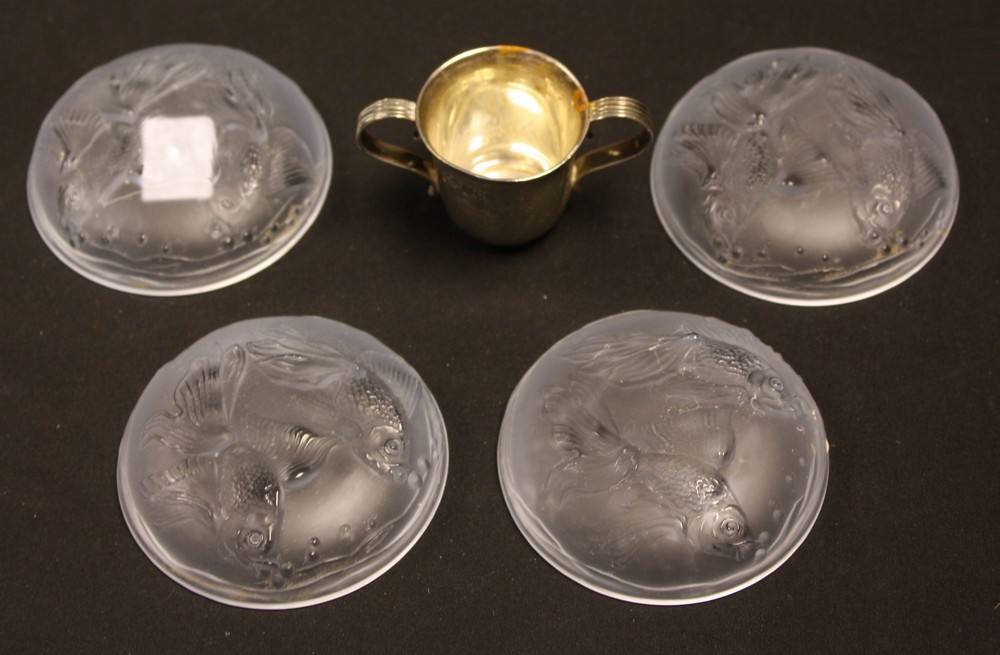 A set of four pale blue frosted glass dishes, each moulded with a pair of fish, 7.