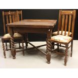An early 20th century oak draw-leaf dining table; four barley twist chairs, c.