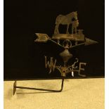 A reproduction cast metal wall mounted weather vane,
