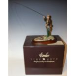 A Border Fine Arts resin model, Fly Fisherman, designed by D Geenty, wooden plinth base,