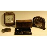 A 1950's oak mantel clock; a miniature oak priory style blanket box musical box;