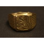 A yellow metal heavy weight signet ring, stamped 750 18k, size W, 11.