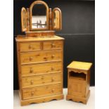 A tall pine chest of two short over four long drawers;