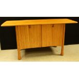 An Ercol Saville elm low sideboard, oversailing rectangular top above a pair of cupboard doors,