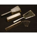 An Art Deco silver backed brush and mirror set;