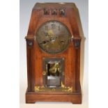 An Arts & Crafts mahogany cased architectural mantel clock