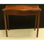 A George III mahogany serpentine card table,