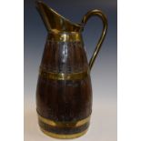 A wooden brass coopered jug,