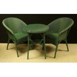 A pair of Lloyd Loom Lansdown type chairs;