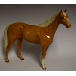 A large Beswick model of a Palomino horse, 29.