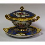 A French Le Tallec porcelain covered bowl and stand, painted panels of flowers on blue ground,