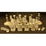 Cut glass decanters, a pair with silver collars, others with silver collars, stoppers,
