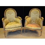 A pair of Louis XVI Neo-Classical giltwood and painted armchairs, arched back with ribbon crestings,