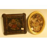 A 19th century needlework kettle stand; an oval needlework picture, depicting a girl with a cat,