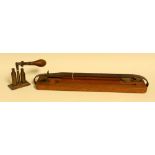 An early 20th century oak sportsman's game carrier, brass mounts, leather strap,
